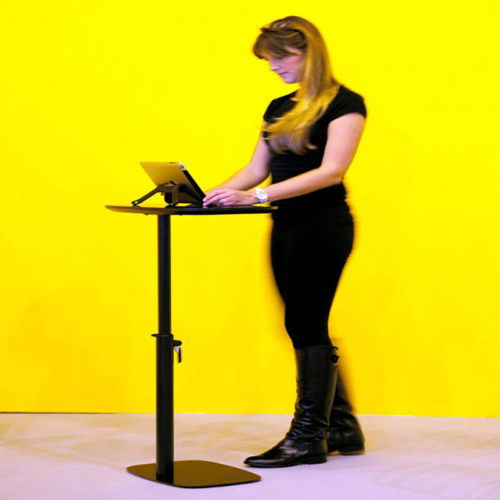 Woman standing at Black Height Adjustable Laptop Table
